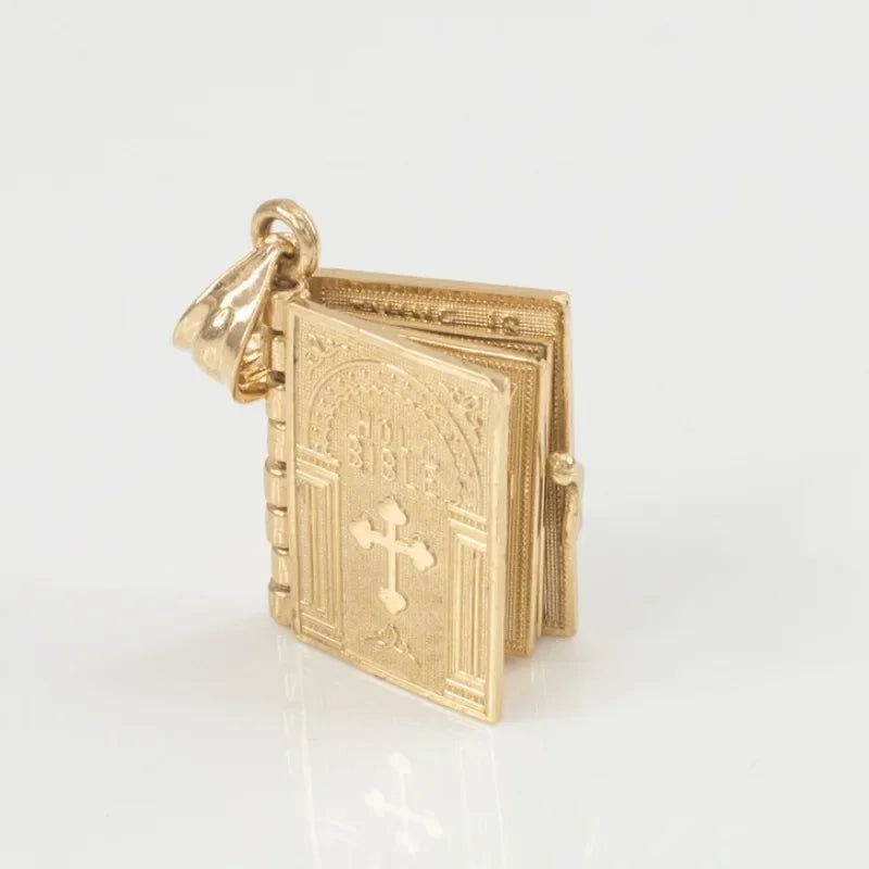 Religious necklace with a Holy Bible that can open up.