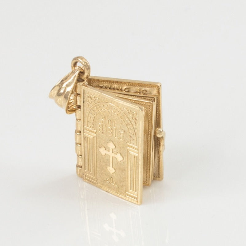 Religious necklace with a Holy Bible that can open up.