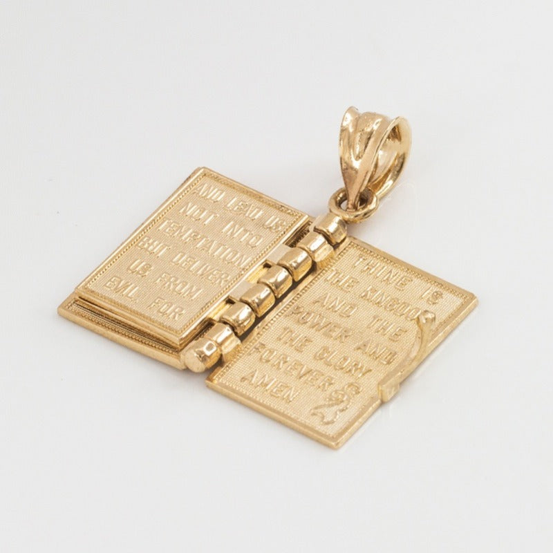 Religious necklace with a Holy Bible that can open up.